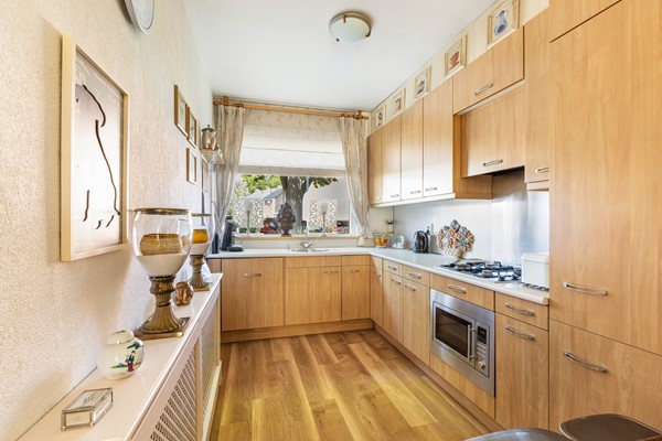 Foto - Te koop: Goed onderhouden tussenwoning in rustige woonwijk!